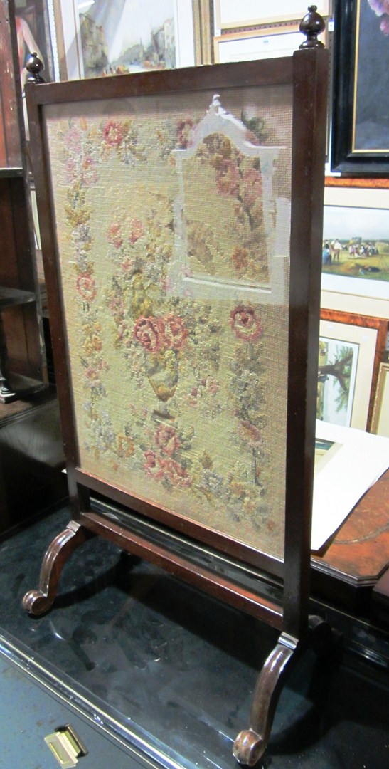 Appraisal: A th century fire screen with floral tapestry panel