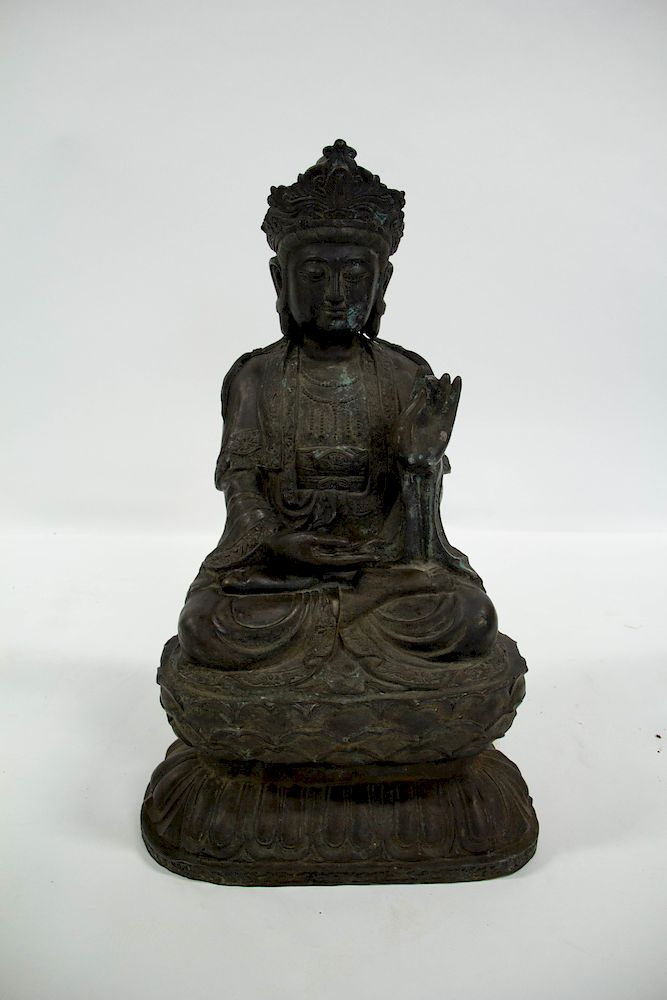 Appraisal: A Large Cast Metal Figure of Guanyin The hollow cast