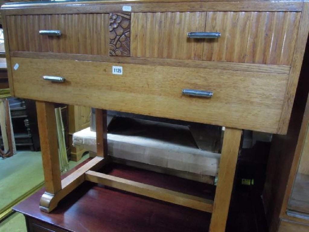 Appraisal: A 's oak dressing table fitted with an arrangement of