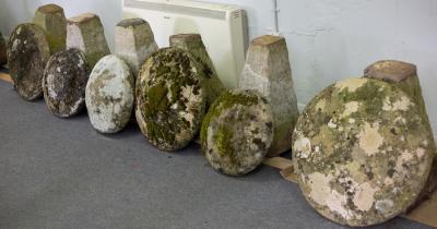 Appraisal: Six staddle stones with tapered bases the tallest approximately cm