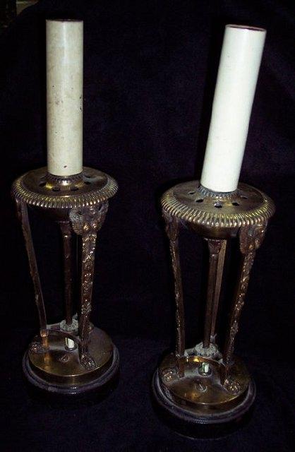 Appraisal: A pair of ormolu table lamps in the form of