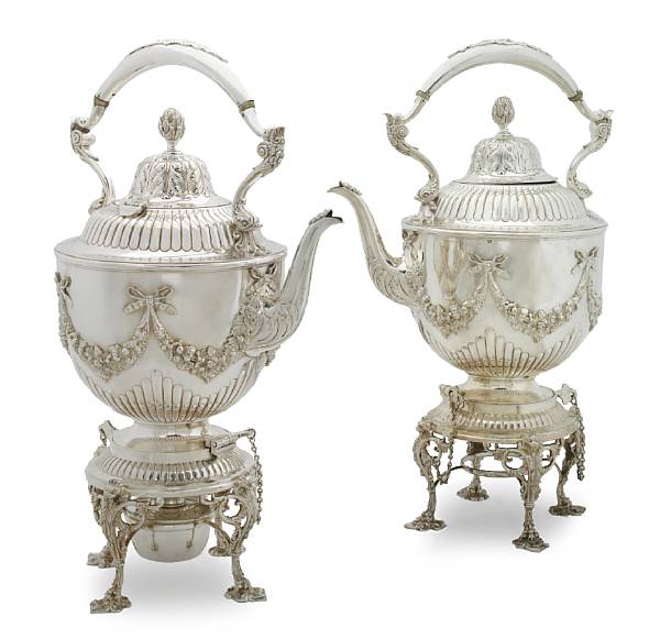 Appraisal: A pair of English plated coffee and tea kettles on