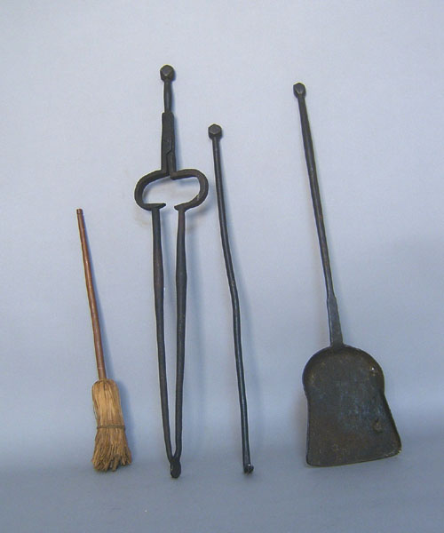 Appraisal: Wrought iron fire tongs shovel and poker together with a