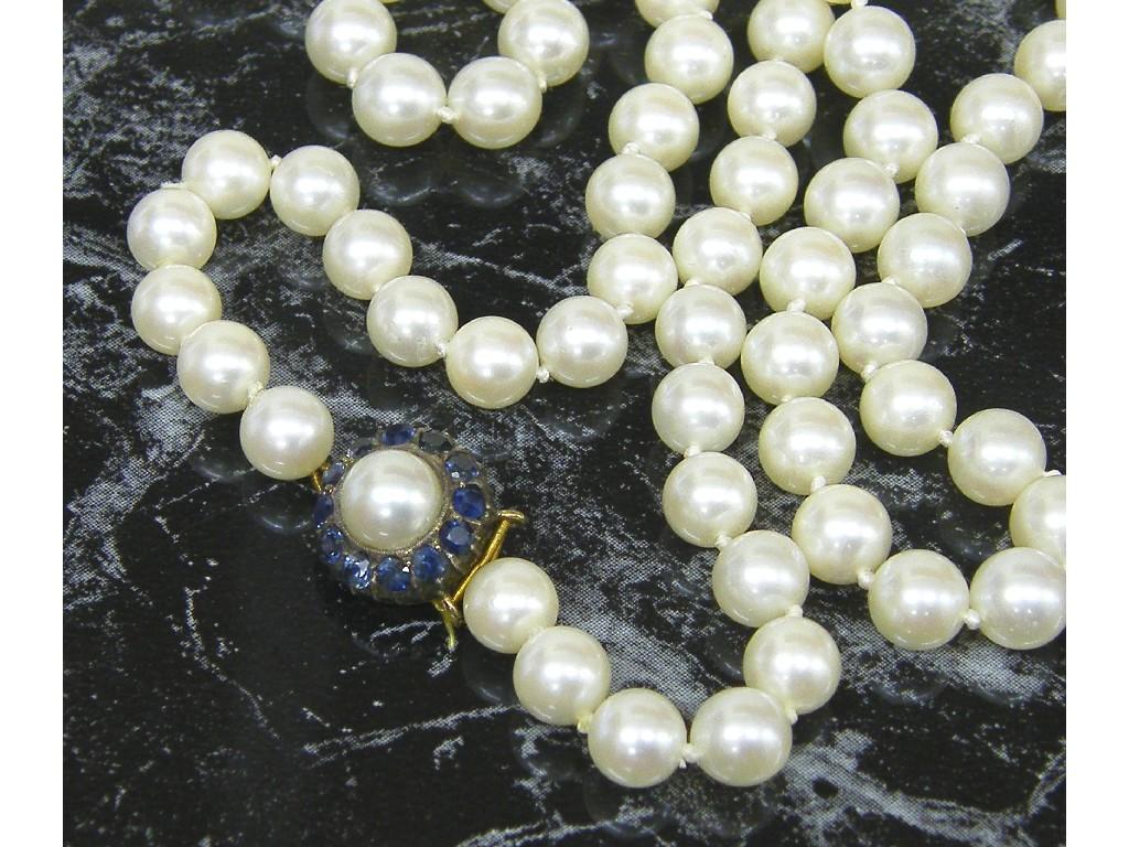 Appraisal: Cultured pearl necklet with a gold sapphire and pearl clasp