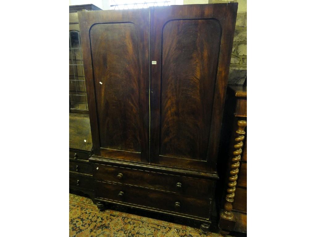 Appraisal: A th century mahogany linen press the upper section enclosed