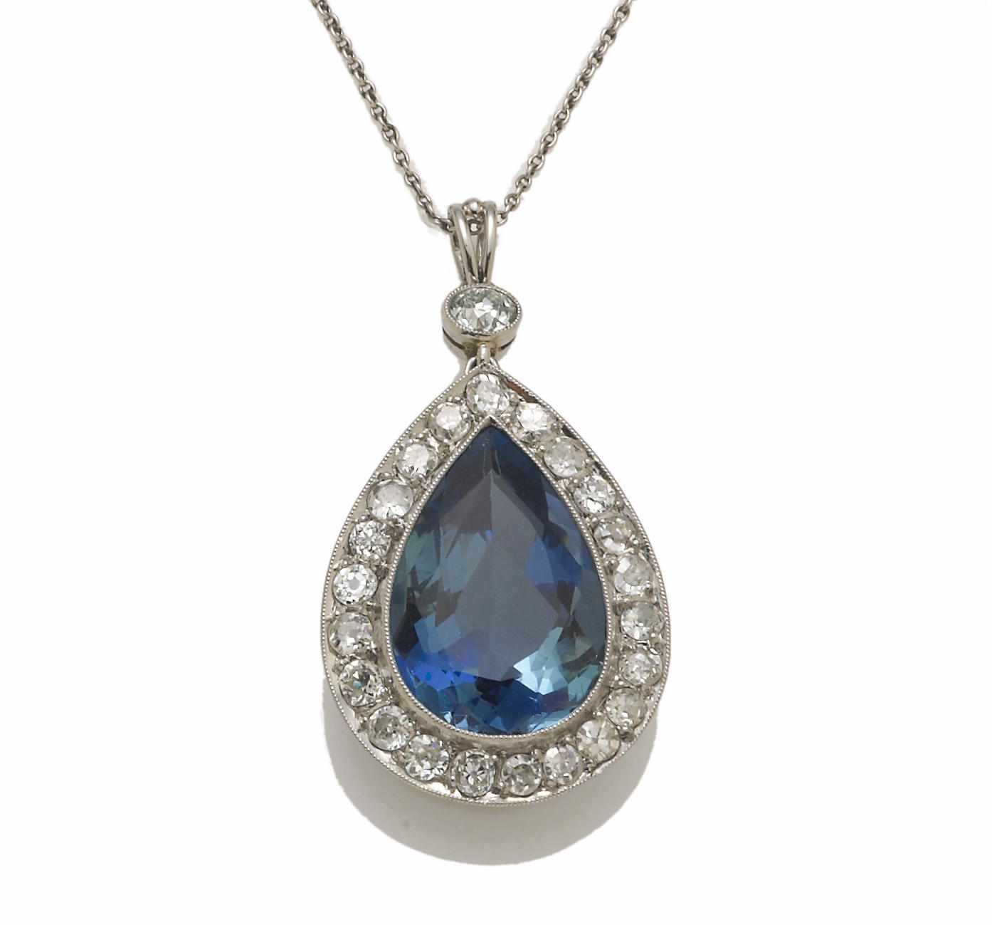 Appraisal: An aquamarine and diamond pendant with chain pear-shaped aquamarine weighing