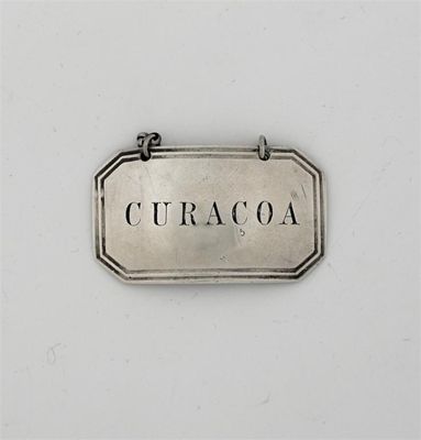 Appraisal: A Victorian canted oblong wine label incised for CURACOA with