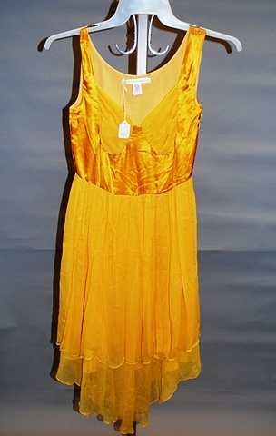 Appraisal: Mustard color silk jersey with sheer overskirt Not worn -