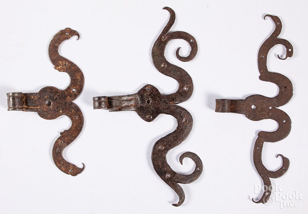 Appraisal: Three wrought iron rams horn hinges Three wrought iron rams