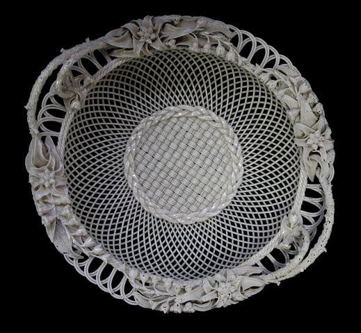 Appraisal: A Belleek Sydenham Twig circular two-handled basket with three-strand weave