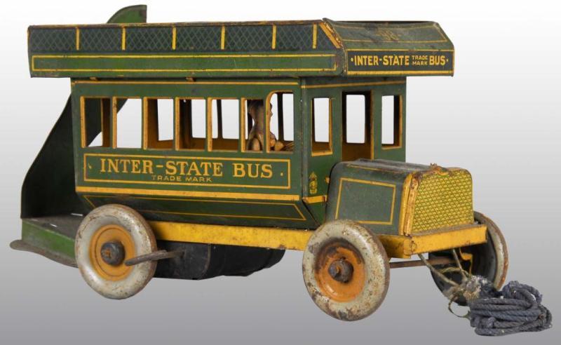 Appraisal: Tin Strauss Inter State Bus Wind-Up Toy Description American Working