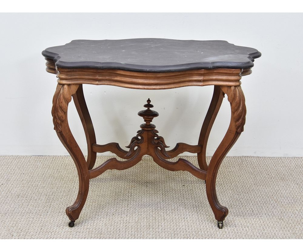 Appraisal: Victorian Carved Walnut Table Victorian carved walnut table with shaped