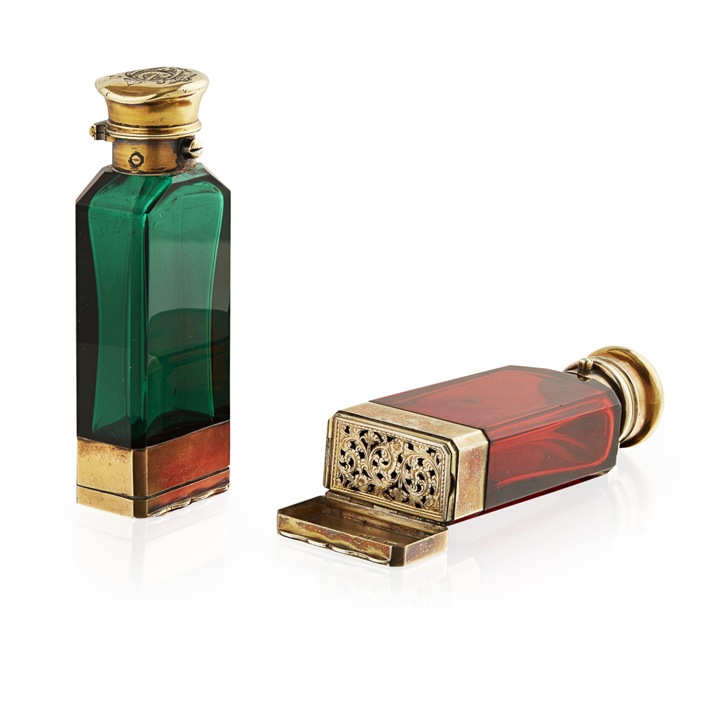 Appraisal: Two Victorian coloured glass and silver gilt mounted scent bottles