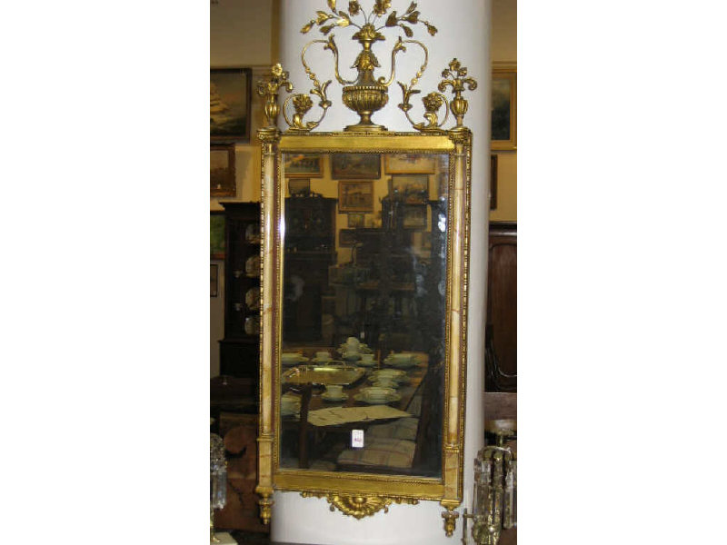 Appraisal: ADAM'S STYLE GILT FRAMED WALL MIRROR Centering a flowering urn