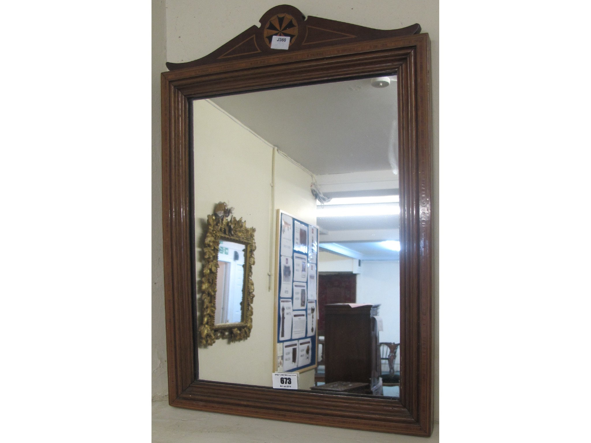 Appraisal: An Edwardian inlaid hall mirror