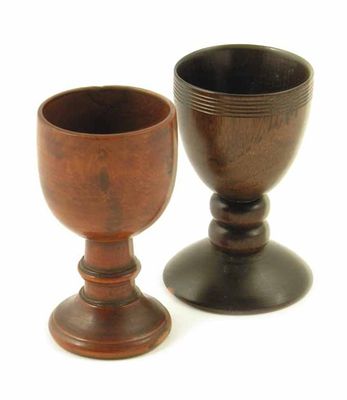 Appraisal: An th century turned maple salt with a knopped stem