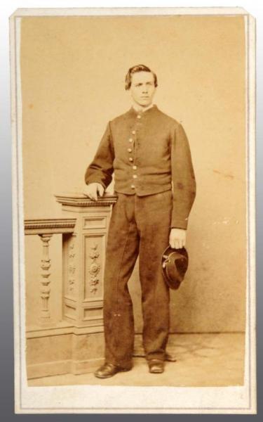 Appraisal: Unidentified Soldier CDV Description Full standing view with nine button