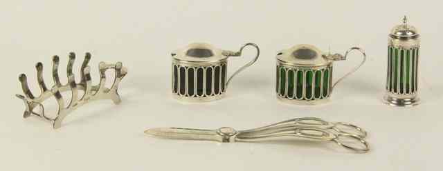 Appraisal: Two silver mustard pots a matching pepper pot Sheffield a