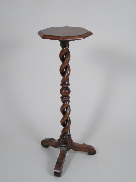 Appraisal: An antique walnut Candlestand with cross-banded and feather strung octagonal