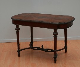 Appraisal: A Victorian walnut centre table the shaped top with carved