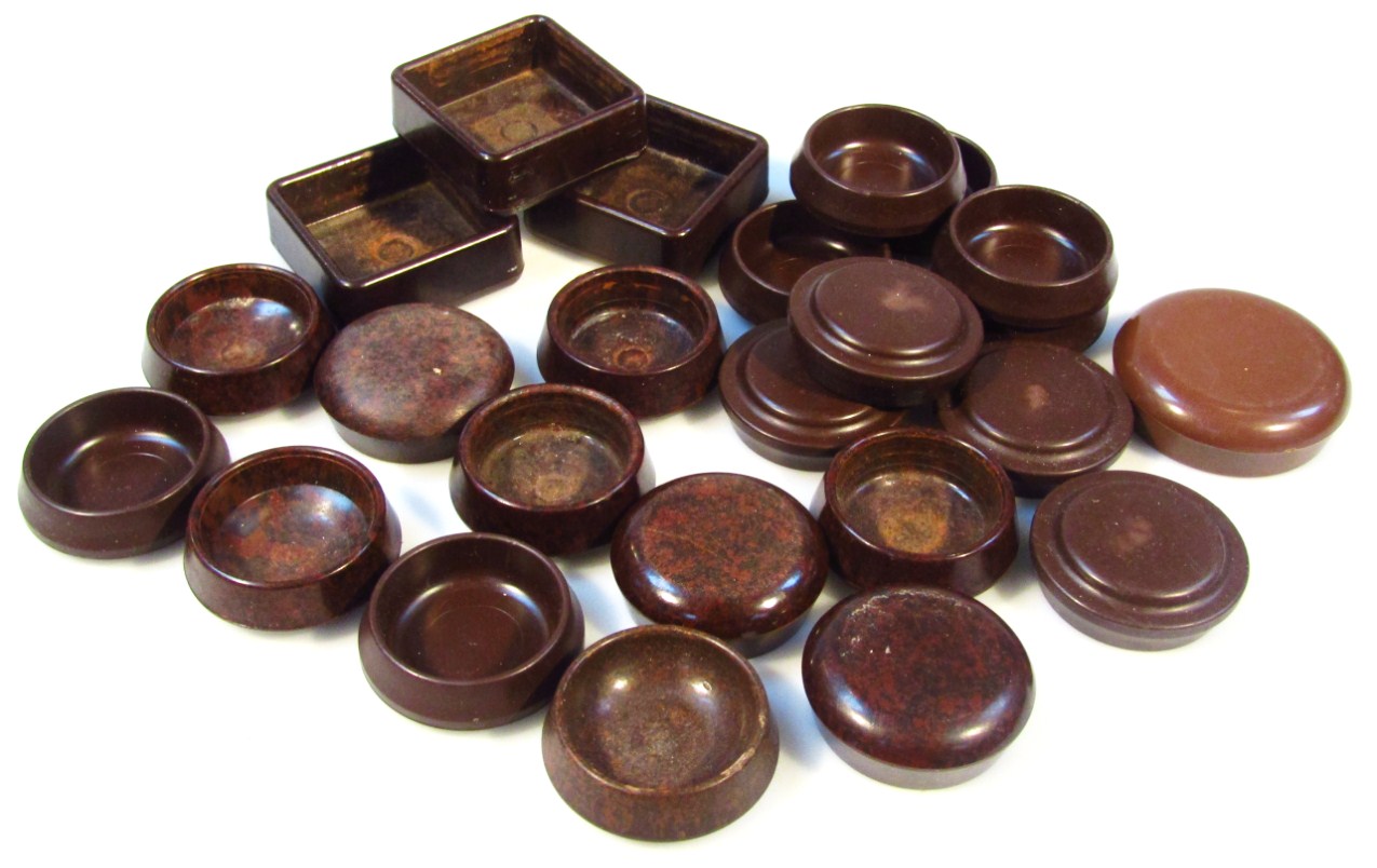 Appraisal: Various early thC brown Bakelite furniture castor protectors three square