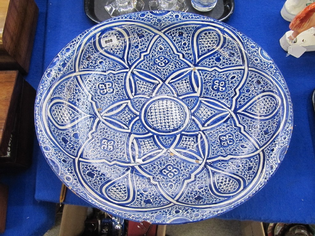 Appraisal: Large tin glazed charger decorated in blue and white