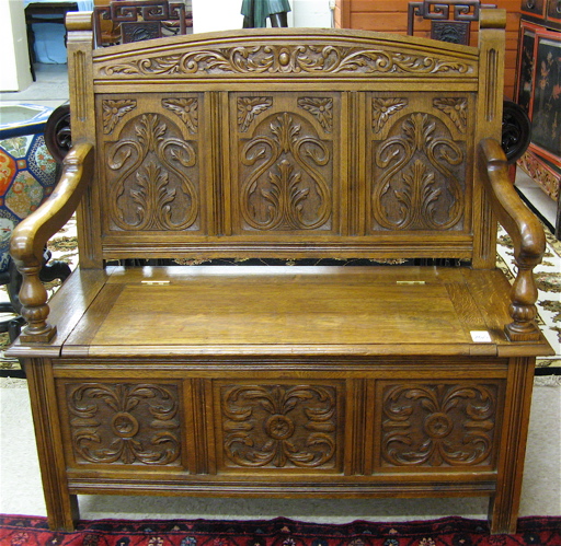 Appraisal: CARVED OAK SETTLE English c having a relief-carved panel back