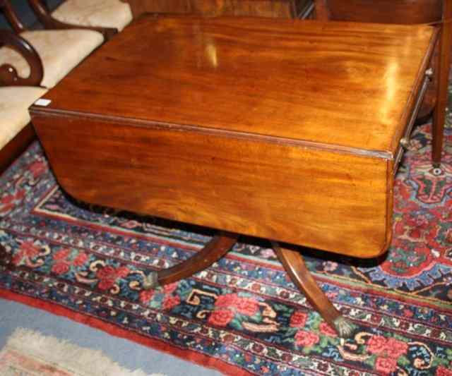 Appraisal: A REGENCY MAHOGANY PEMBROKE TABLE the top with rounded flaps