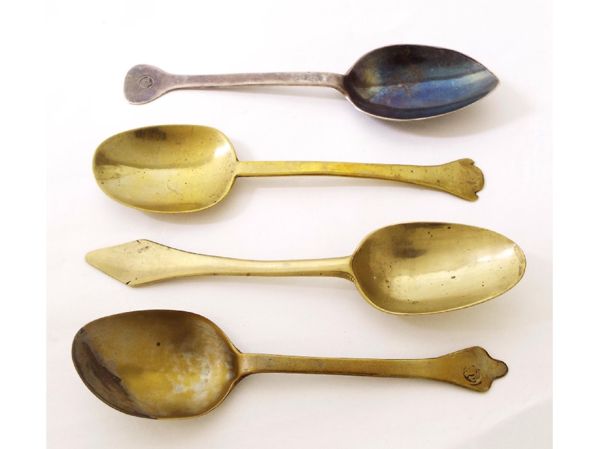 Appraisal: Four various th th century latten Puritan type spoons long