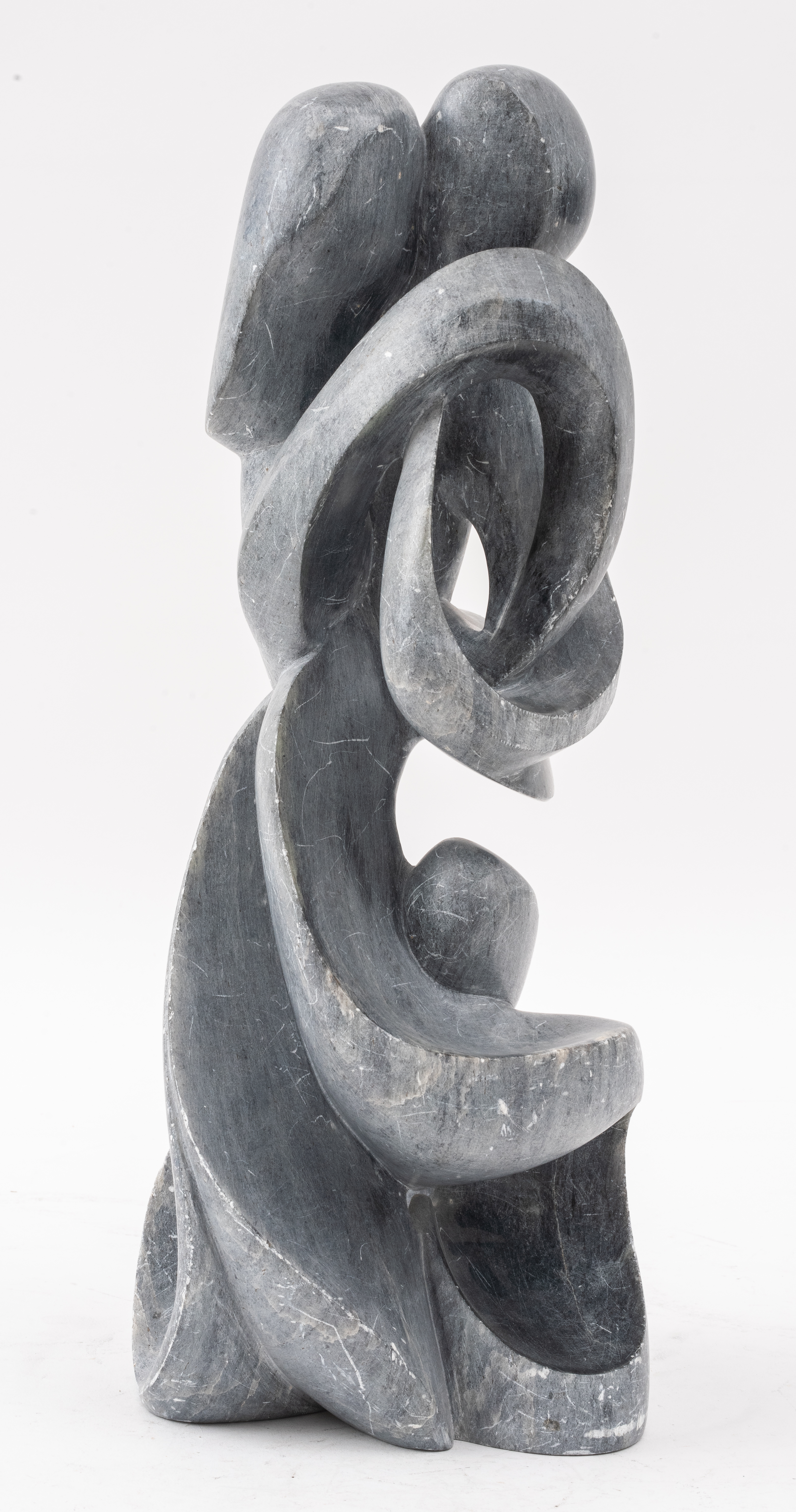 Appraisal: ALAIN PREVOST STONE SCULPTURE OF EMBRACING COUPLE Alain Prevost American