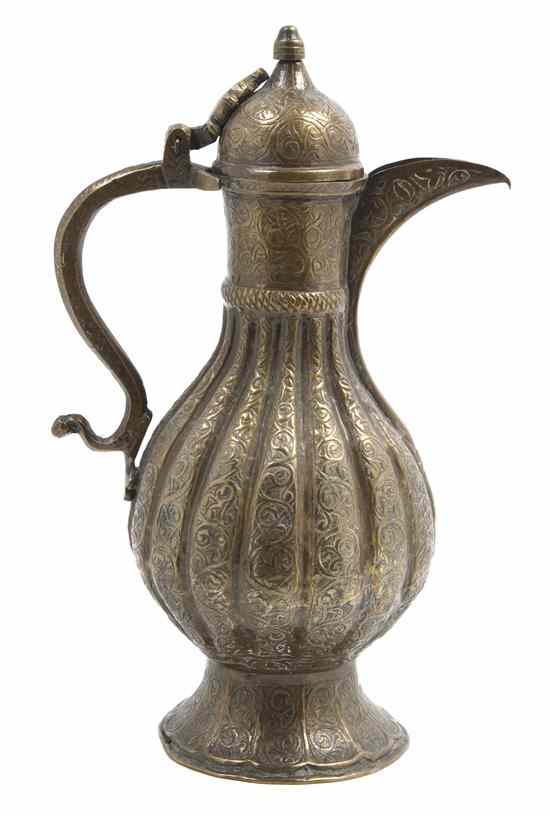 Appraisal: An Indian Gilt Metal Ewer the domed lid with finial