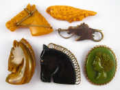 Appraisal: A mixed lot of six Bakelite or similar brooches including