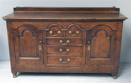 Appraisal: th century oak panelled dresser base the centre with two