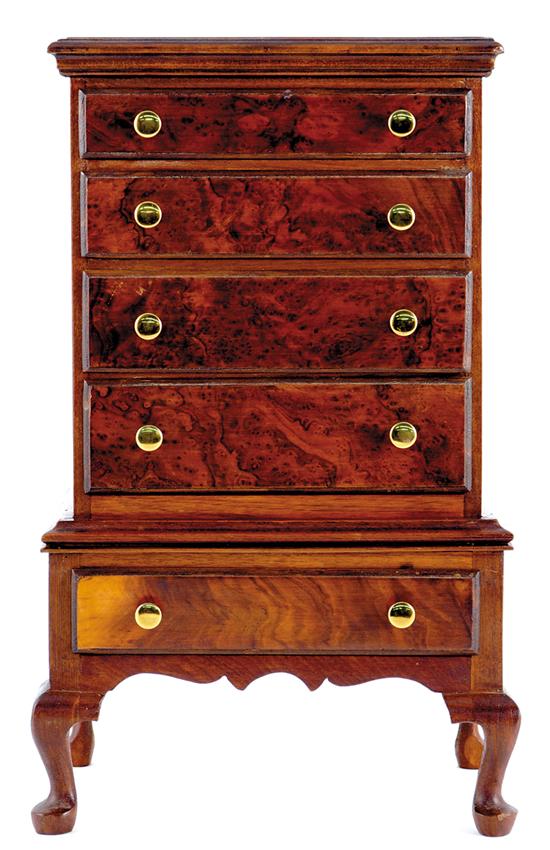 Appraisal: Miniature mahogany and bird's-eye maple highboy molded crown over four