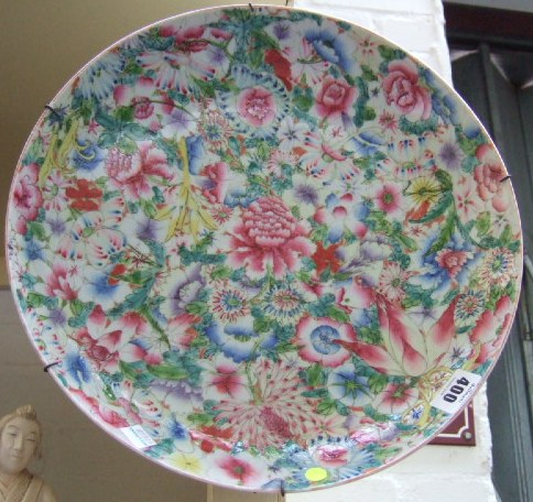 Appraisal: A Cantonese porcelain charger painted overall with flowers in famille