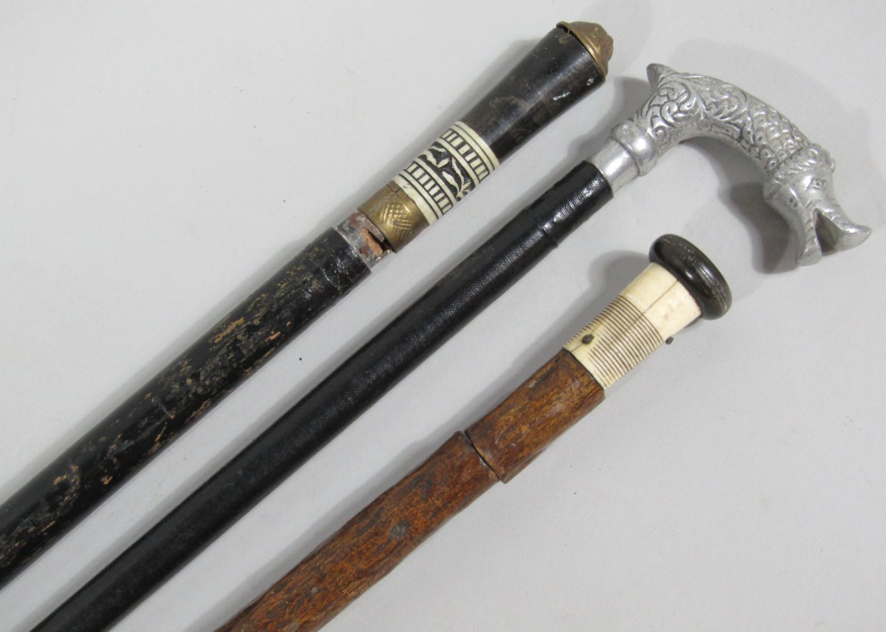 Appraisal: Three antique sword sticks AF