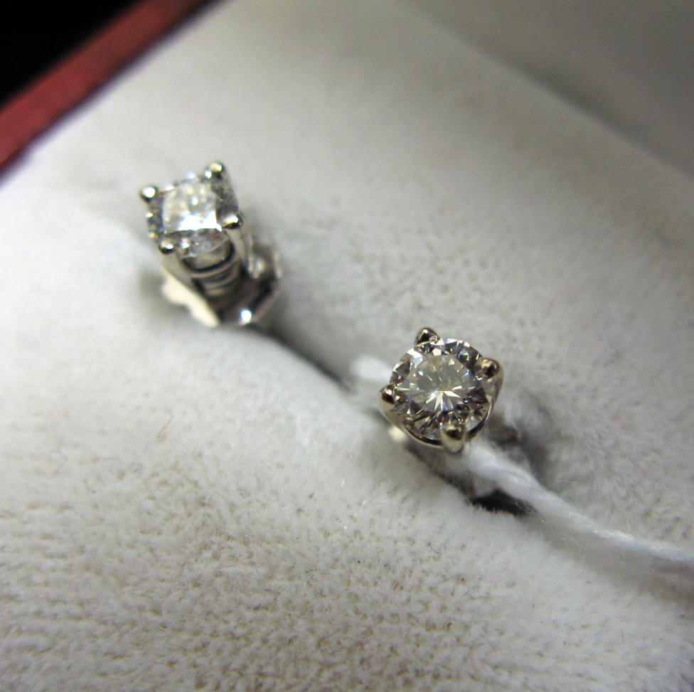 Appraisal: PAIR OF DIAMOND AND FOURTEEN KARAT WHITE GOLD EAR STUDS