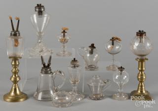 Appraisal: Miscellaneous colorless glass and brass fluid lamps th c tallest