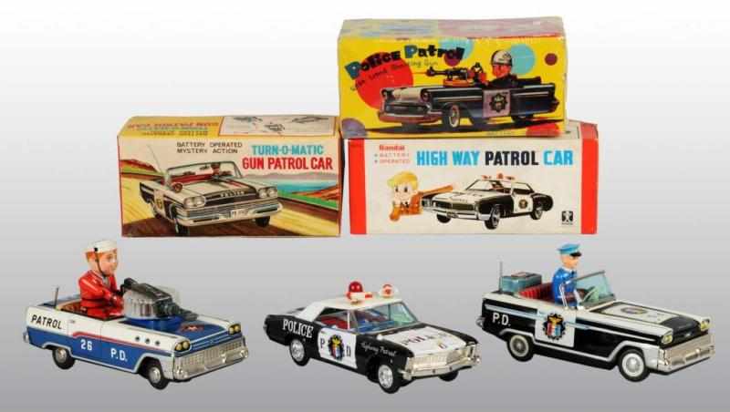 Appraisal: Lot of Tin Police Dept Car Battery-Op Toys Description Japanese