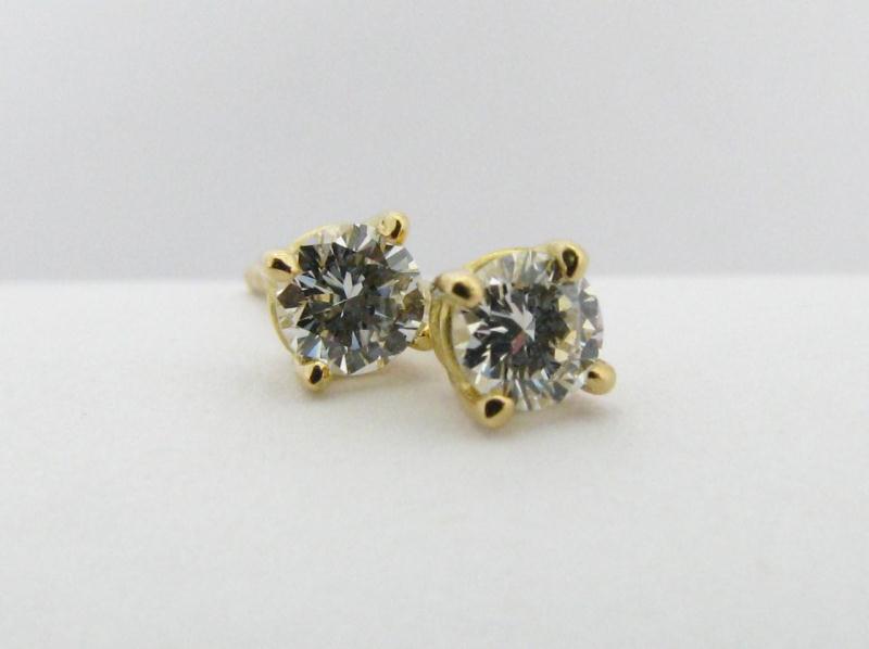 Appraisal: Tiffany Co K Yellow Gold Diamond Solitaire Earrings approximately ct