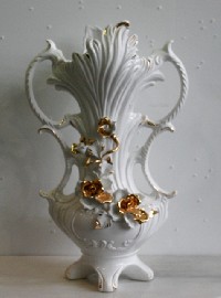 Appraisal: A pair of white and gold Naples Capodimonte vases of