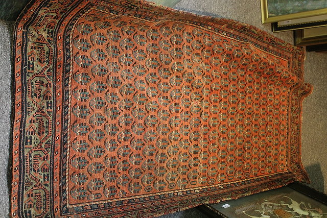 Appraisal: A BELUCH BLACK GROUND RUG with simple flower head designs