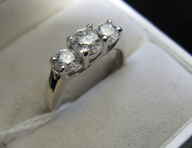 Appraisal: DIAMOND AND FOURTEEN KARAT WHITE GOLD THREE STONE RING set