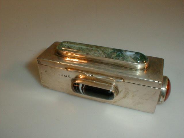 Appraisal: An Edwardian rectangular silver snuff box the hinged lid set