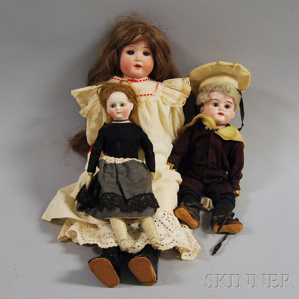 Appraisal: Three Small Dolls a Heubach bisque shoulder head girl doll