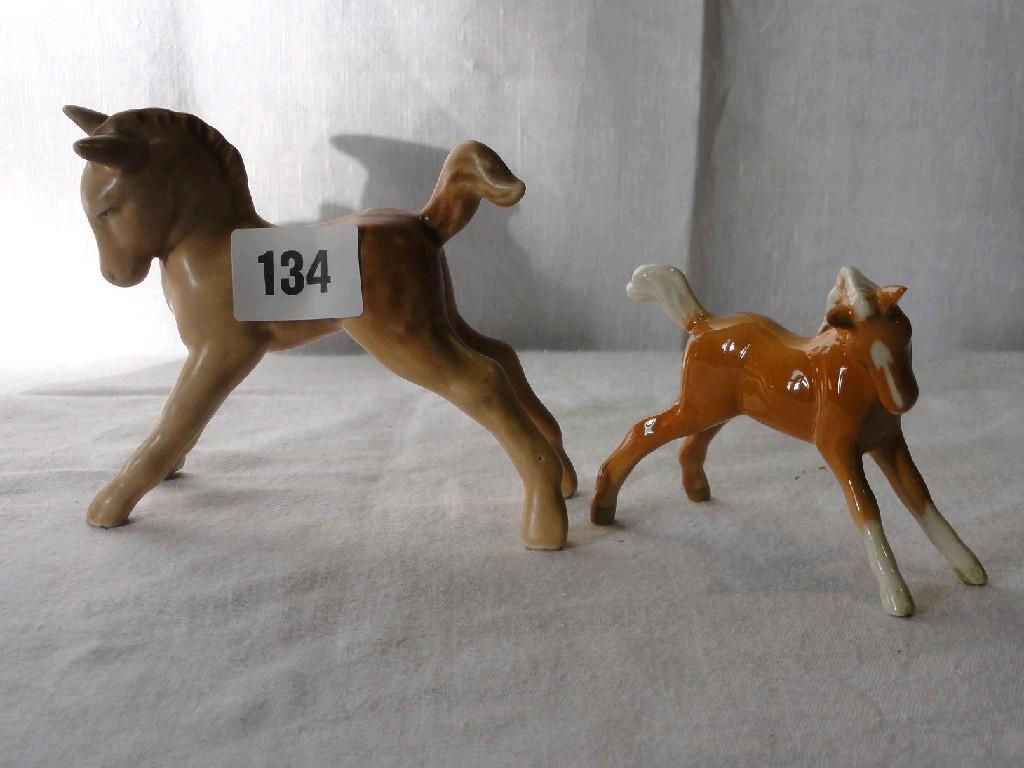 Appraisal: A Beswick model of a prancing Palomino foal together with