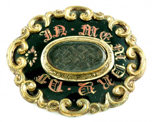 Appraisal: Victorian mourning brooch Goldfilled scrolled frame with black enameling marked