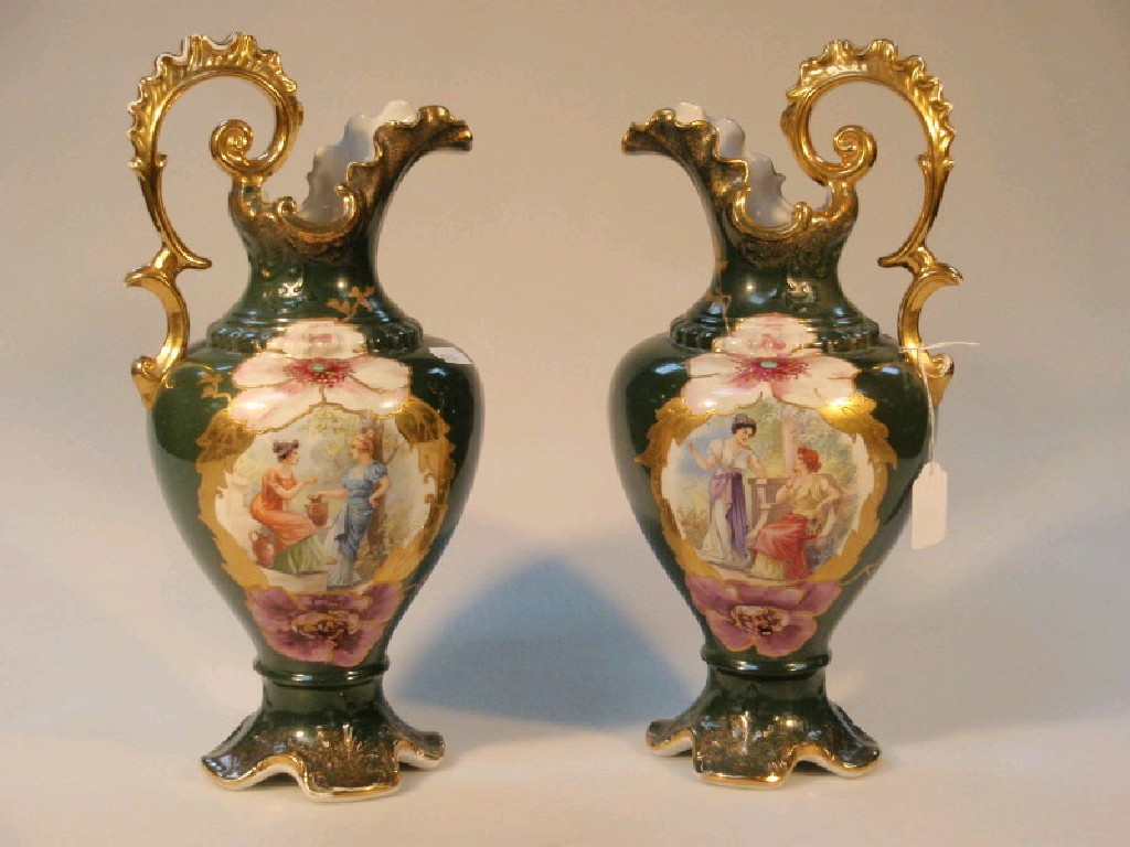 Appraisal: A pair of Staffordshire green ewers with transfer printed neo