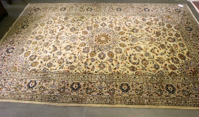 Appraisal: A Tabriz style wool carpet in cobalt and mustard on