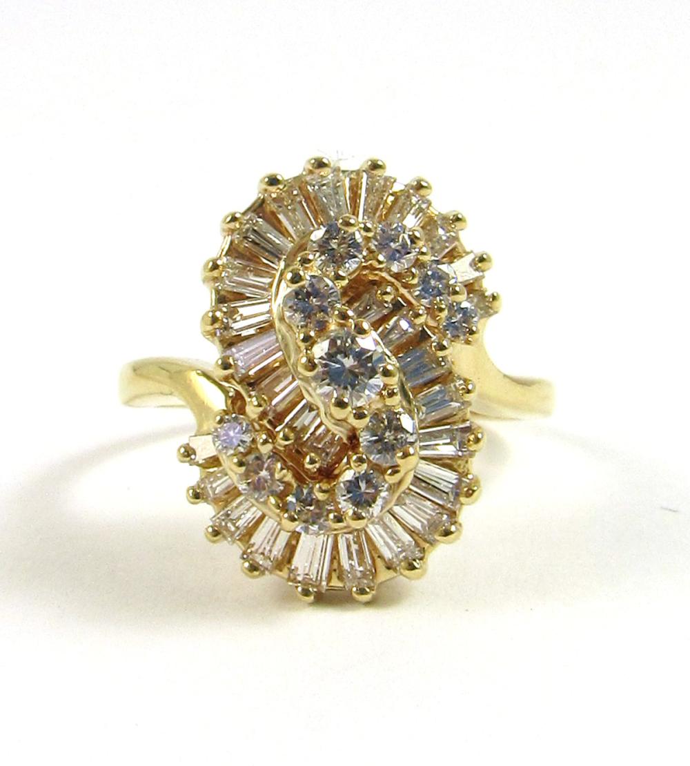 Appraisal: DIAMOND AND FOURTEEN KARAT GOLD RING with an S-shaped cluster